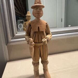 Hand carved wood and corn husk pilgrim.